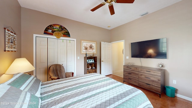 bedroom with ceiling fan, a closet, and light wood-type flooring