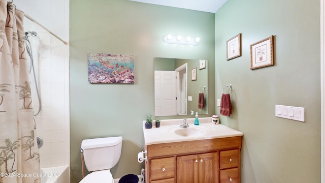 full bathroom with vanity, shower / bath combo, and toilet