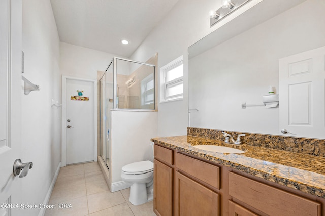 bathroom with vanity, tile patterned floors, a shower with shower door, and toilet