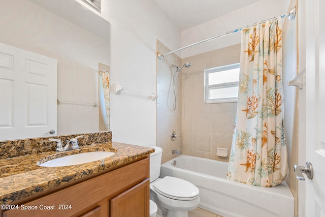 full bathroom featuring shower / bath combo with shower curtain, vanity, and toilet