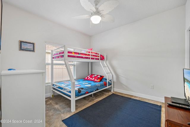 bedroom with ceiling fan and carpet floors