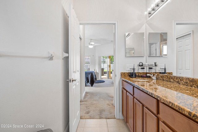 bathroom featuring tile patterned flooring, vanity, and ceiling fan