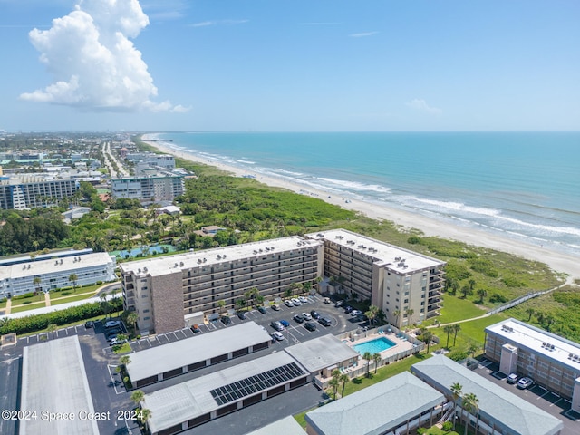 aerial view featuring a water view and a beach view