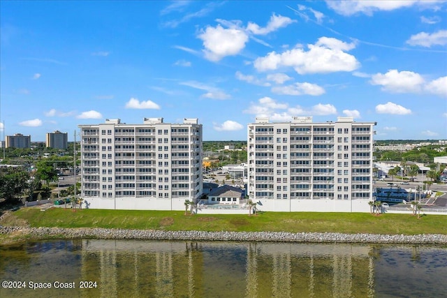 view of building exterior with a water view