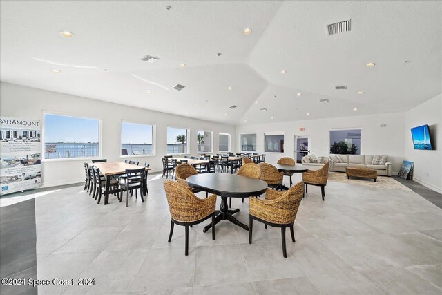 dining area with lofted ceiling