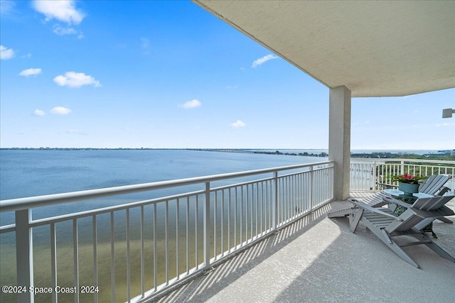 balcony featuring a water view