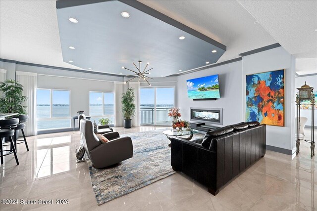 living room with a textured ceiling and crown molding