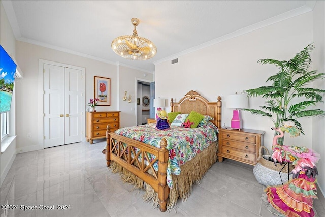 bedroom featuring ornamental molding and a closet