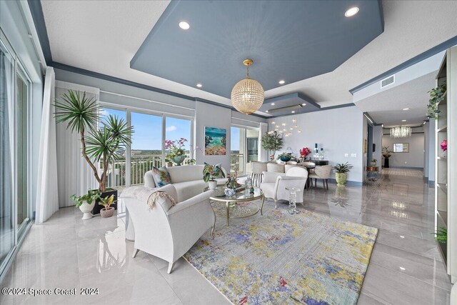 living room featuring a tray ceiling