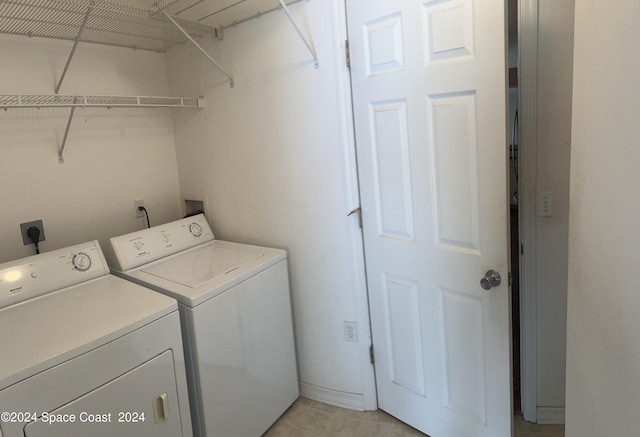 laundry room featuring washing machine and dryer