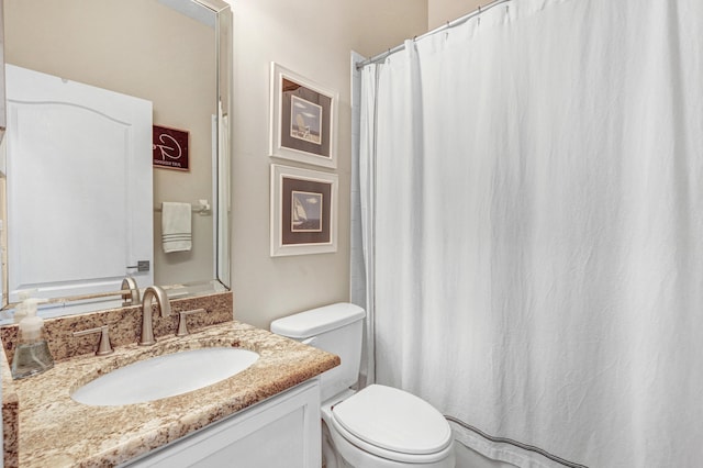 bathroom with toilet and vanity