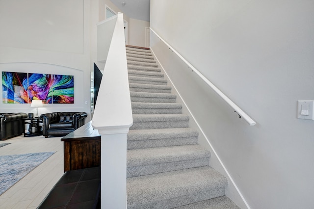 stairway featuring tile patterned floors