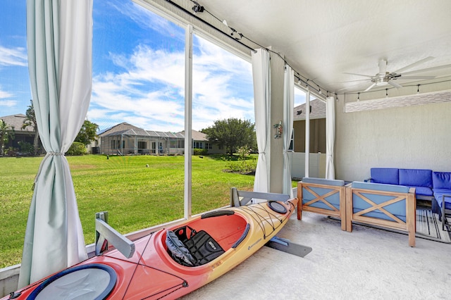 sunroom / solarium with ceiling fan