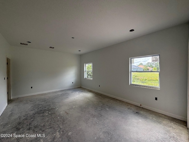 empty room featuring a textured ceiling