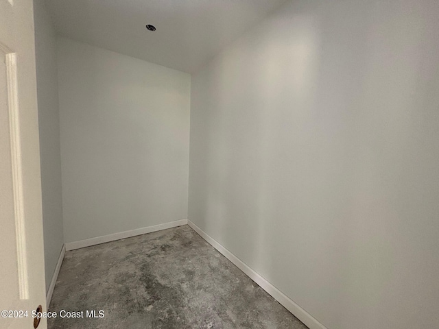 spare room with concrete flooring