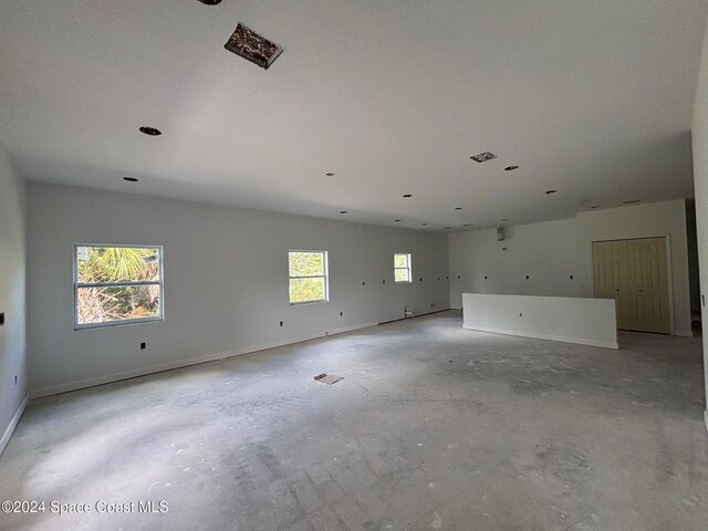 unfurnished room featuring plenty of natural light