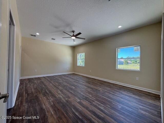 3250 San Jose Ave SE, Palm Bay, FL 32909 - spare room with ceiling fan, dark wood-style floors, a textured ceiling, recessed lighting, and baseboards