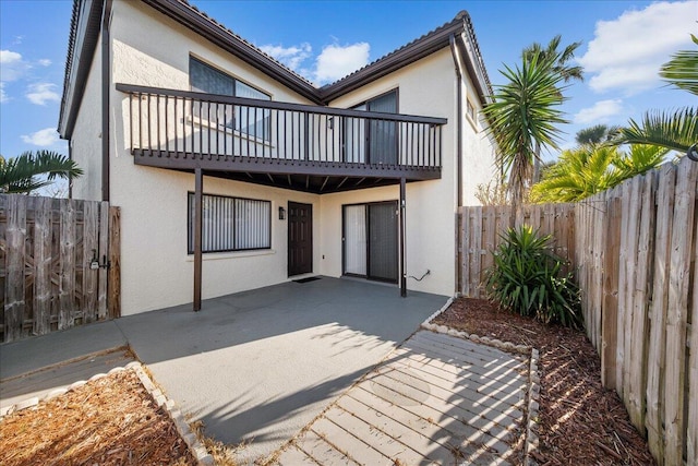 rear view of property with a patio area