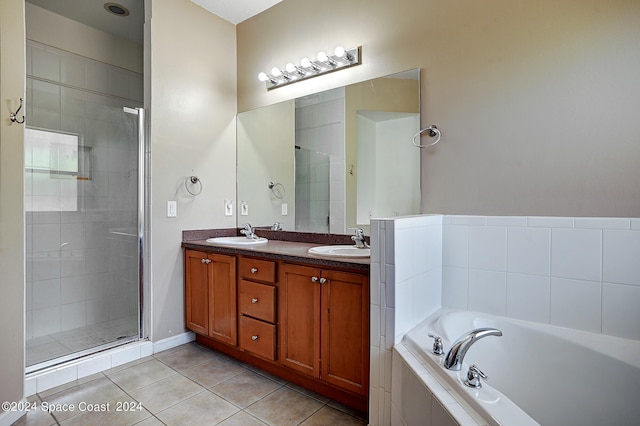 bathroom featuring vanity, plus walk in shower, and tile patterned floors