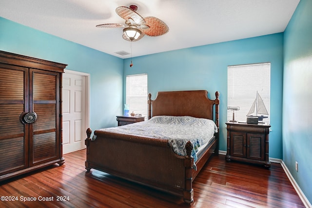 bedroom featuring ceiling fan and dark hardwood / wood-style floors