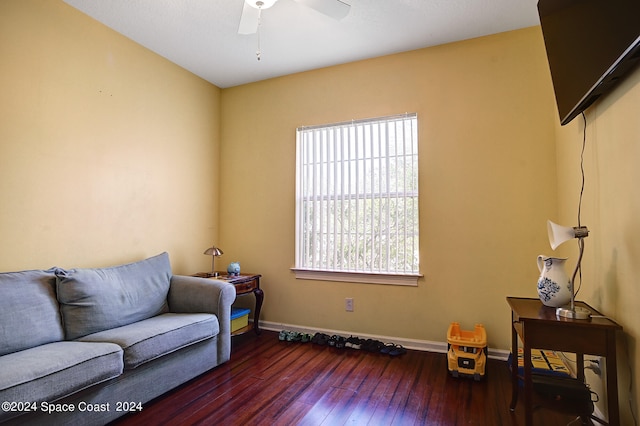 interior space with ceiling fan and dark hardwood / wood-style flooring