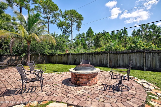 view of patio / terrace with a fire pit