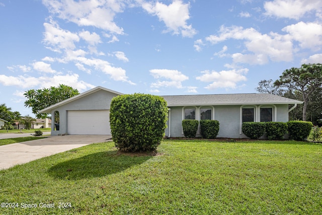 ranch-style home with a front lawn and a garage