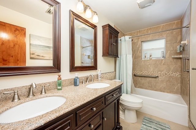 full bathroom with vanity, tile patterned flooring, toilet, and shower / bath combo