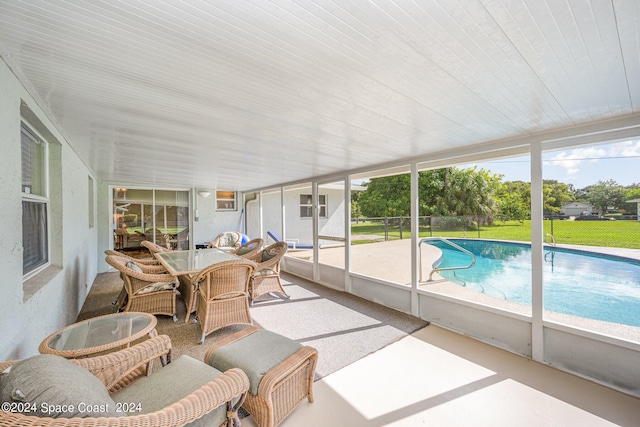 sunroom / solarium featuring plenty of natural light