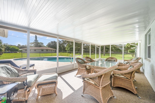 view of swimming pool featuring a patio and a yard