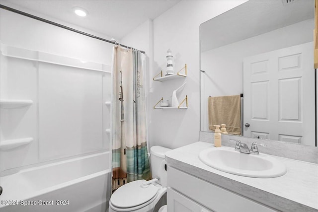 full bathroom with vanity, toilet, and shower / bath combo with shower curtain