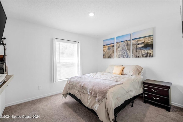 bedroom with light carpet