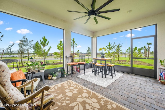 sunroom / solarium with ceiling fan