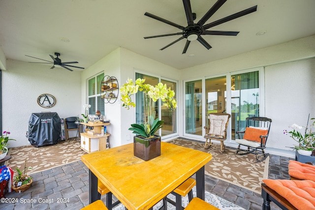 sunroom / solarium with stone tile flooring