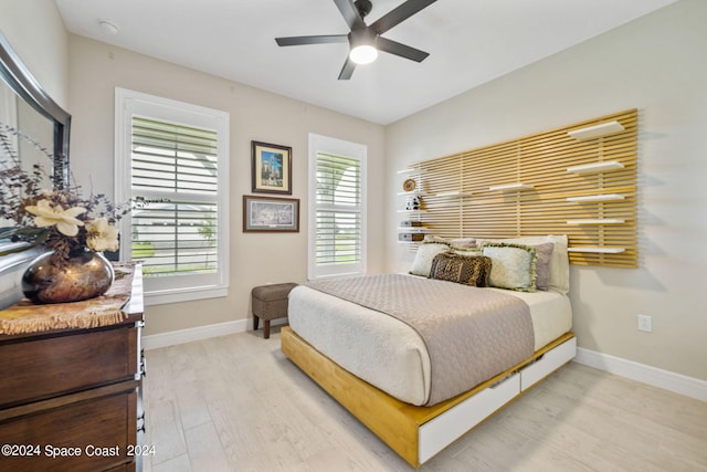 bedroom with ceiling fan and light hardwood / wood-style flooring