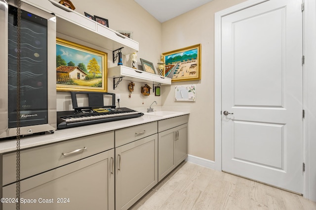 interior space with vanity and hardwood / wood-style flooring