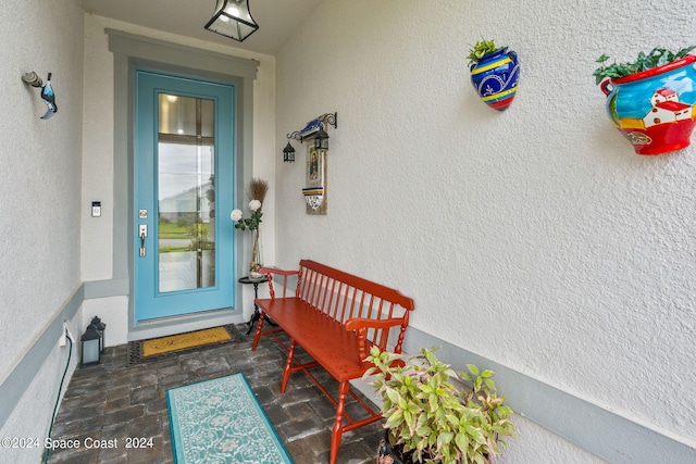 property entrance featuring stucco siding