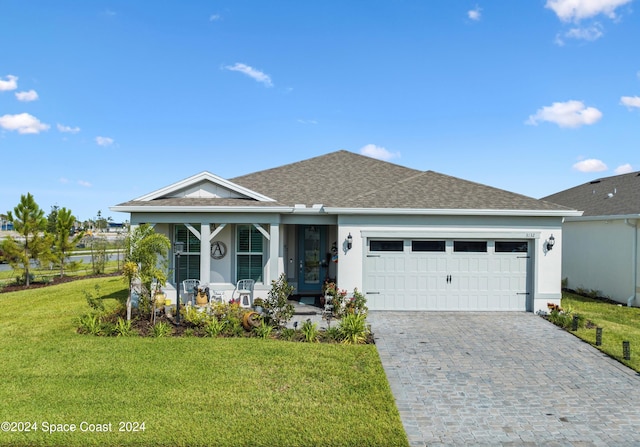 view of front facade with a garage, a front lawn, decorative driveway, stucco siding, and a porch