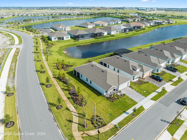 birds eye view of property featuring a water view and a residential view