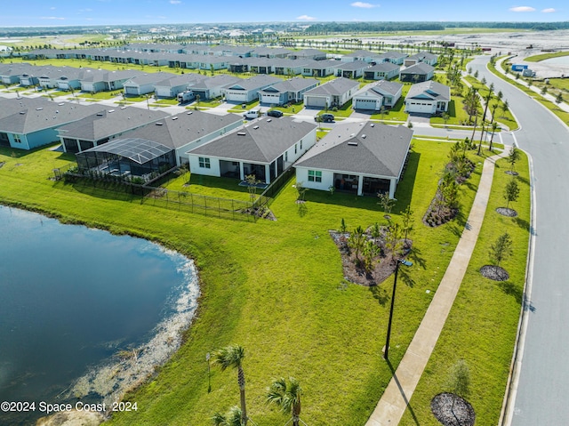 birds eye view of property with a residential view and a water view