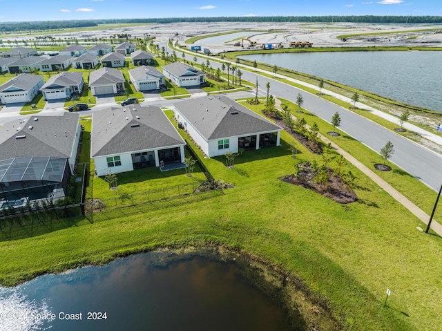 aerial view featuring a residential view and a water view