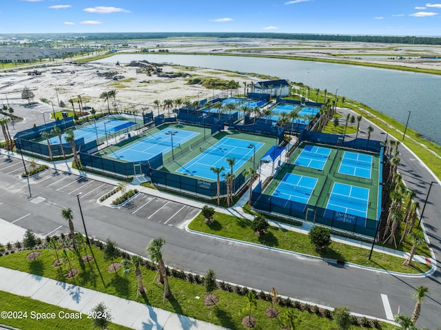 birds eye view of property with a water view