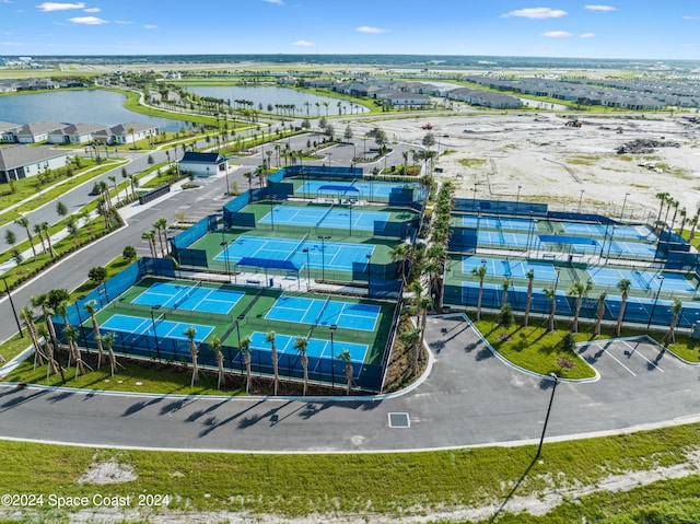 birds eye view of property with a water view