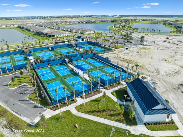 bird's eye view with a water view and a residential view