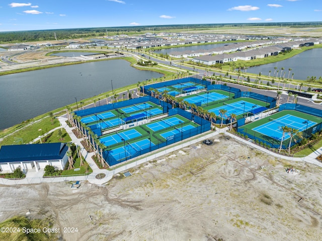 birds eye view of property with a water view