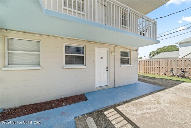 property entrance with a balcony