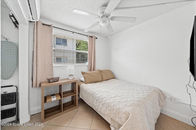 bedroom featuring ceiling fan and light tile patterned flooring