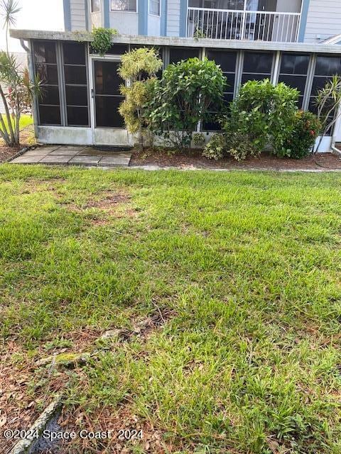 view of yard with a sunroom