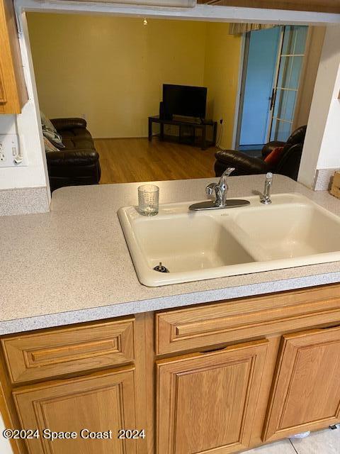 bathroom with vanity and hardwood / wood-style flooring