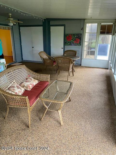 sunroom / solarium with ceiling fan